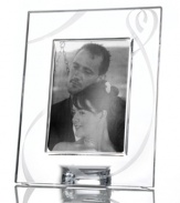 Fall for the elegant True Love giftware collection. A crystal picture frame etched with a romantic heart design is a sweet way to commemorate a special anniversary or congratulate the bride and groom. Qualifies for Rebate