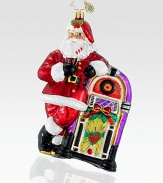 Cut from vibrant European glass, a jolly Santa kicks back while listening to some timeless holiday tunes. Hand-blownHand-painted5½ tallMade in Poland