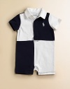 This classic rugby design with bold colorblocking features signature pony embroidery for an authentic polo touch.Ribbed polo collarShort sleevesHidden front button placketBottom snapsCottonMachine washImported Please note: Number of buttons and snaps may vary depending on size ordered. 
