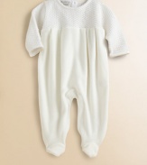 A beautiful knit top meets a velour bottom for an ultra-plush one-piece for baby.CrewneckLong sleevesBack buttonsBottom snapsPima cottonMachine washImported Please note: Number of snaps and buttons may vary depending on size ordered. 