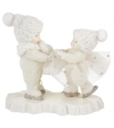 With innocent looks upon their faces, this pair of Snowbabies, with silver ice skates and white hats, are having a grand time ice skating together. Crafted of pure porcelain in the timeless style of Department 56.