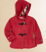 An ultra-toasty wool coat with toggle buttons, attached hood, check lining and pretty peplum hem for your little snow bunny.Attached hood with button closureShoulder patchesLong sleeves with snap cuffsFront zip with toggle buttonsPeplum hemFully linedWoolDry cleanImported