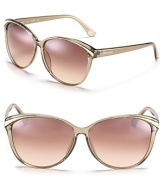 Retro-inspired cat eye sunglasses with contrast winged detail.