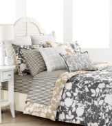 This Mont Clair decorative pillow features floral and dotted embroidery with a thin band of charcoal for a hem. Minimal in color, yet vibrant in pattern, this decorative pillow from Tommy Hilfiger is perfect for heightening the minimalistic look of the Mont Clair bedding design. (Clearance)