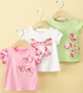 Frilly floral-patterned appliques add girlish appeal to this adorable shirt from First Impressions.