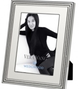 Add new elegance to beautiful memories with Vera Wang's With Love Blanc picture frame. Geometric detail lends metallic shimmer to creamy white enamel in a home accent that invokes modern and deco design.