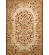 Traditionally inspired elegance. With an ornate motif in soft beige and green hues, Safavieh's Heritage rug takes any room from attractive to stunning in moments. Hand-tufted of pure wool with strong cotton backing, the rug can withstand even the most highly traveled areas of your home. (Clearance)