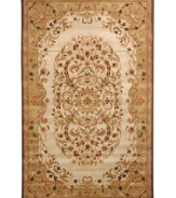 Traditionally inspired elegance. With an ornate motif in soft beige and green hues, Safavieh's Heritage rug takes any room from attractive to stunning in moments. Hand-tufted of pure wool with strong cotton backing, the rug can withstand even the most highly traveled areas of your home. (Clearance)