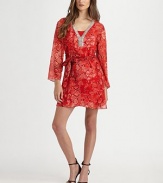 Breezy silk chiffon finished in bold snake print and glittering rhinestone trim.V necklineRhinestone trim front yokeSelf-beltSide zipperFully linedAbout 33 from shoulder to hem95% silk/5% spandexDry cleanImportedModel shown is 5'9 (175cm) wearing US size Small.