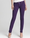 Gleaming silver signature accents enhance the rich hue of these MICHAEL Michael Kors jeans, cut in a slim silhouette for an all-around on-trend look.