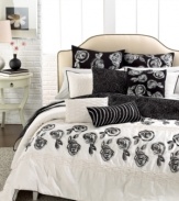 Black and cream hues take center stage on this Home by Steve Madden Camille quilt, featuring delicate petals and flat piping trim.