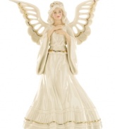 Every tree needs an angel! Top your tree with this glowing angel figurine, draped in pure ivory porcelain and gold trim.