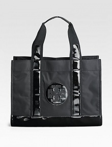 This simple and roomy style in sturdy nylon, with glossy PVC trim is the perfect accessory for a day trip or running errands around town.Double top handles, 6½ drop Open top Two inside zip pockets Canvas lining 15½W X 12H X 6D Imported