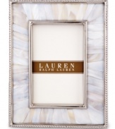 Enhance the look of any photo when framed in the beauty of Mother of Pearl. A slim line of metal surrounds this natural composition with the classic style of Lauren Ralph Lauren.