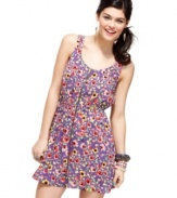 Dress to charm in this adorable frock from Material Girl, where crisscross back detail adds grade A spunk to a supremely girlish dress!