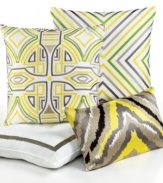 Featuring a white background with grey, beige, green & yellow embroidery, this Trina Turk decorative pillow adds a burst of color and modern sophistication to your bed.