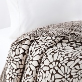 Keep it simple...or dress it up with color. This collection is white on black in a bold, abstract floral print. In a soft cotton, this set complements any modern bedroom.