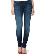 Levi's pairs the classic styling of its 524 skinny jeans with a saturated dark wash and expert fade!