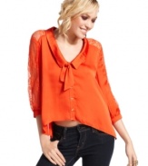 Tres-cute: a peter pan collar adds a playful touch to this lace-adorned, high-low blouse from XOXO!