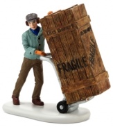 A deliveryman drops off a very tall order for Ralphie's old man in this true-to-life figurine from A Christmas Story Village by Department 56.