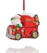 Rudolph and his reindeer pals take a break as Santa speeds the Macy's Christmas truck through the snow. A teddy bear co-pilot rides in the back.