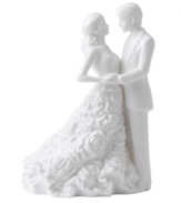 Something new for the stylish couple. A couture cake topper fashioned in white bone china offers a modern alternative to the traditional must-have. By Monique Lhuillier.