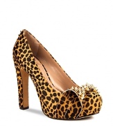 VINCE CAMUTO's Jamma platforms are not-so-sweet--a girlish bow is toughened up with spiked gold-tone studs.