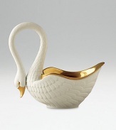 This graceful swan in white porcelain and 14kt gold accents is perfect for serving or decoration. Hand-gilded 7 edition: 3W X 7H X 6½D 13 edition: 6W X 13H X 13D Made in Portugal