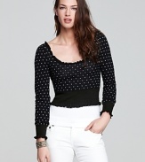 Taking its inspiration from dance-chic warmup wear, this Free People top boasts petite polka dots and a cropped silhouette.