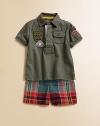 A rugged set pairs a military-inspired cotton mesh polo with a preppy madras short and D-ring belt for a sporty, casual ensemble. Shirt Shirt collarShort sleevesFront button placketFront patch pocketEven-vented hem Shorts Button closureElastic waistband with belt loopsFaux flySide on-seam pocketsBack patch pocketCottonMachine washImported Please note: Number of buttons may vary depending on size ordered. 