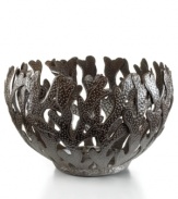 Made entirely of recycled steel, the Coral bowl is intricately cut and hammered by Haitian metal artisans to evoke the life-giving sea that laps their shores. Rich texture in its crisscrossed branches add to the special nature of each handmade piece.