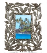 Painstakingly cut, hammered and varnished by hand, this meaningful picture frame displays your favorite people and places in the tree of life. Steel from recycled barrels gives each one-of-a-kind piece a rustic beauty perfected by Haiti's master artisans.