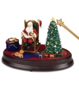 The holiday spirit comes to life in this Night Before Christmas collectible. Use the magical wand to activate a multitude of features: Santa rocks in his chair while reciting The Night Before Christmas, the tree and candle light up and a train circles the tree.