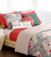 A fun poppy hue and eye-catching quilting make the Trellis duvet cover set an irresistible pick-me-up for tired decor. Top it all off with bright stenciled blooms, geometric prints and a pile of whimsical pillows in coordinating hues. (Clearance)