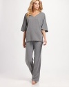 This plush style features pretty dolman sleeves and a flattering v-neckline. V-neckShort dolman sleevesPull-on styleSeamed detail on backAbout 28 from shoulder to hem63% polyester/33% viscose/4% elastaneMachine washImported 