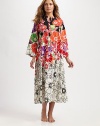 A fierce floral print defines this Asian-inspired, silky-smooth silhouette. JewelneckHalfway zip frontLong sleevesFront slash pocketsAbout 52 from shoulder to hemPolyesterMachine washImported