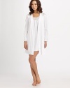 A stand-out piece on its own or paired with a matching gown, this spring look has beautiful embroidered lace at the shoulders for a lightweight effect. Open wrap styleEmbroidered semi-sheer lace at the shouldersLong sleevesAttached self-tie belt with back elastic waistbandAbout 43 from shoulder to hemMercerized cottonMachine washImported