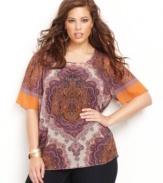 An exotic print lets bold hues stand out! INC's plus size top can be styled casually or dressed up depending on your mood.