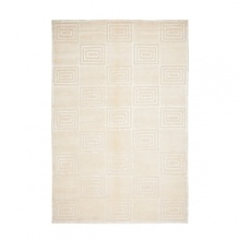 Boasting luxe Art Deco glamour in a monochromatic weave, this Ralph Lauren rug alternates subtly raised geometric tiles with plush velvet squares for classic elegance.