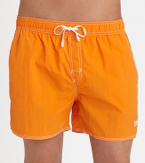 With stitched details and a grip-tape back patch pocket, these stylish swim trunks are both sporty and functional.Elastic drawstring waistStich detail at flySlash side pocketsBack grip-tape patch pocketInseam, about 4½PolyamideMachine washImported