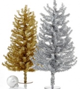 Break out the silver. A polished table topper in shimmering tinsel, this Kurt Adler Christmas tree inspires endless holiday cheer and never leaves a mess.