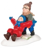 Ralphie catches kid brother Randy when he can't put his arms down in this hilarious figurine from A Christmas Story Village by Department 56.