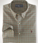 A relaxed-fitting plaid shirt in soft cotton poplin creates a polished masculine look for the gentleman.