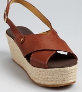 Bettye Muller interprets the season's trendiest shoe in luxe brown leather with a summer-loving espadrille sole. Pair these flatforms with a boho-chic midi skirt for a modern look.