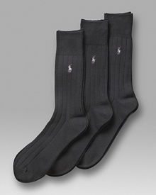 Polo Ralph Lauren 3-pack solid ribbed socks. Solid cotton ribbed sock with polo player embroidery. Banded cuffs.