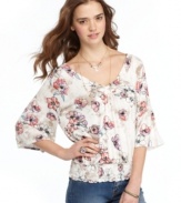 American Rag adds flair to a blouson top with three-quarter bell sleeves and a wide v-neck that gorgeously flaunts your décolletage!