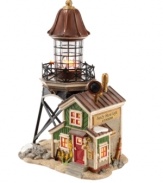 Escape to the seaside. A charming addition to your village-scape, the Sandy Shoal Lighthouse features stunning detailing, like an old-time outpost with bright windows and springtime flowers, a life-like lighthouse with tin-colored roofing and intricate trestles and sandy surroundings complete with rocky accents.