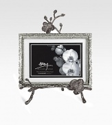 A two-piece easel-style frame finds inspiration in the textures of nature, crafted in hammered and blackened nickel-plated metal by one of America's premier metalwork artists. From the Black Orchid CollectionOverall, 8 X 10½Accommodates a 4 X 6 or 5 X 7 photographImported 