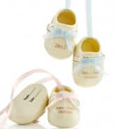 A first step to making your child's first Christmas unforgettable, these baby bootie ornaments are something to treasure in ivory porcelain with fired gold. Record his or her name and the date on its soles.