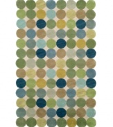 A series of colorful circles stand side-by-side to create a serene ocean of washed out shades of green, blue and gold over a neutral ground. The rug's unique edge, comprised of the collective curves of the outer circles, brings a modern touch to any room in your home. Hand-tufted with an intimate blend of synthetic fibers for a soft, yet durable construction.